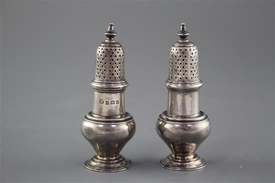 A pair of George V silver baluster pepperettes by S.W. Smith & Co, Birmingham, 1919, height 10.1cm, weight 3.5oz.